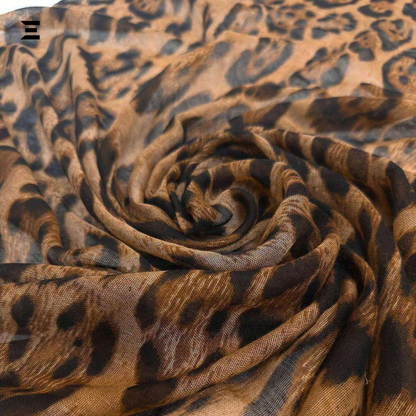 Leopard print fabric rolled up with a brand logo in the corner.